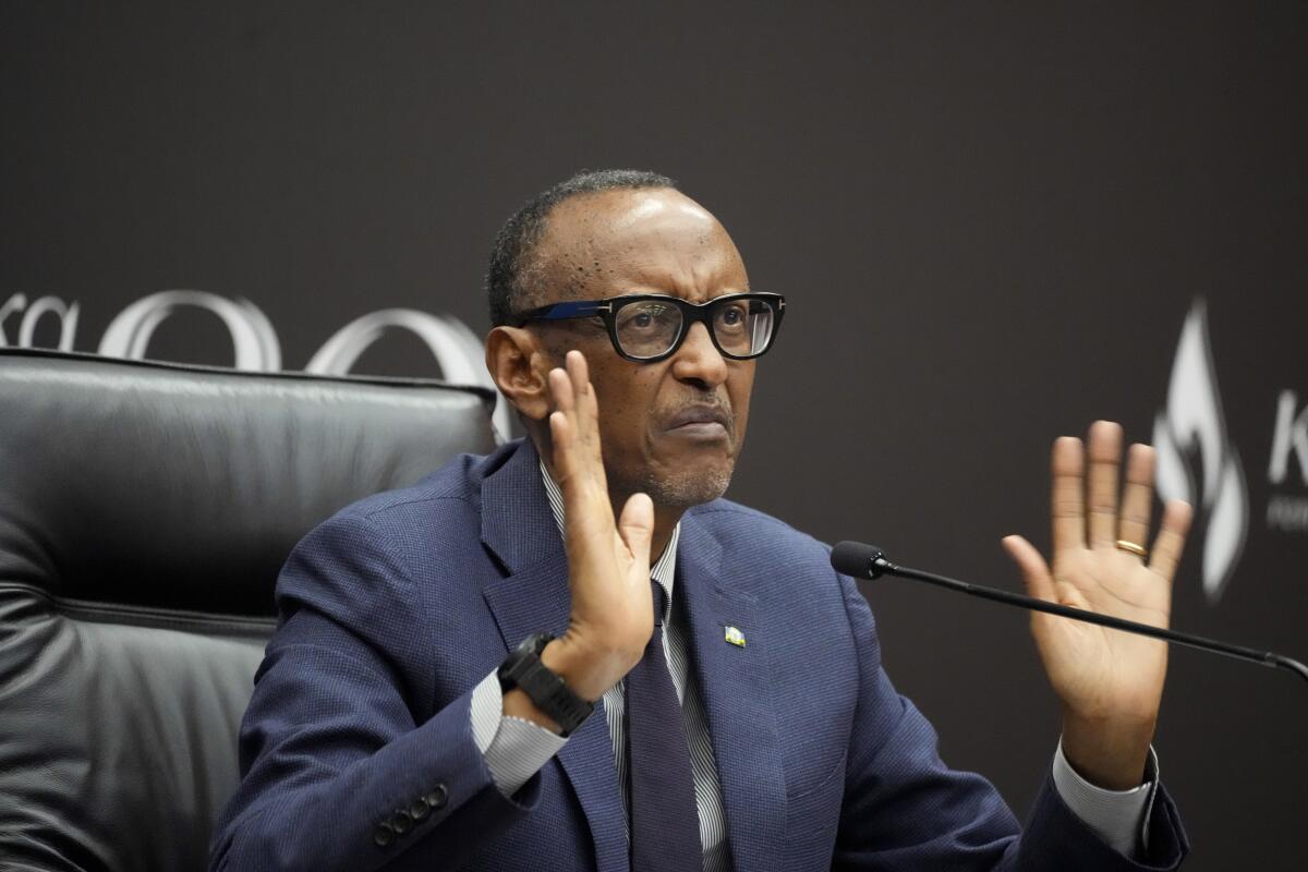 Rwanda's President Paul Kagame gestures as he gives a press conference.