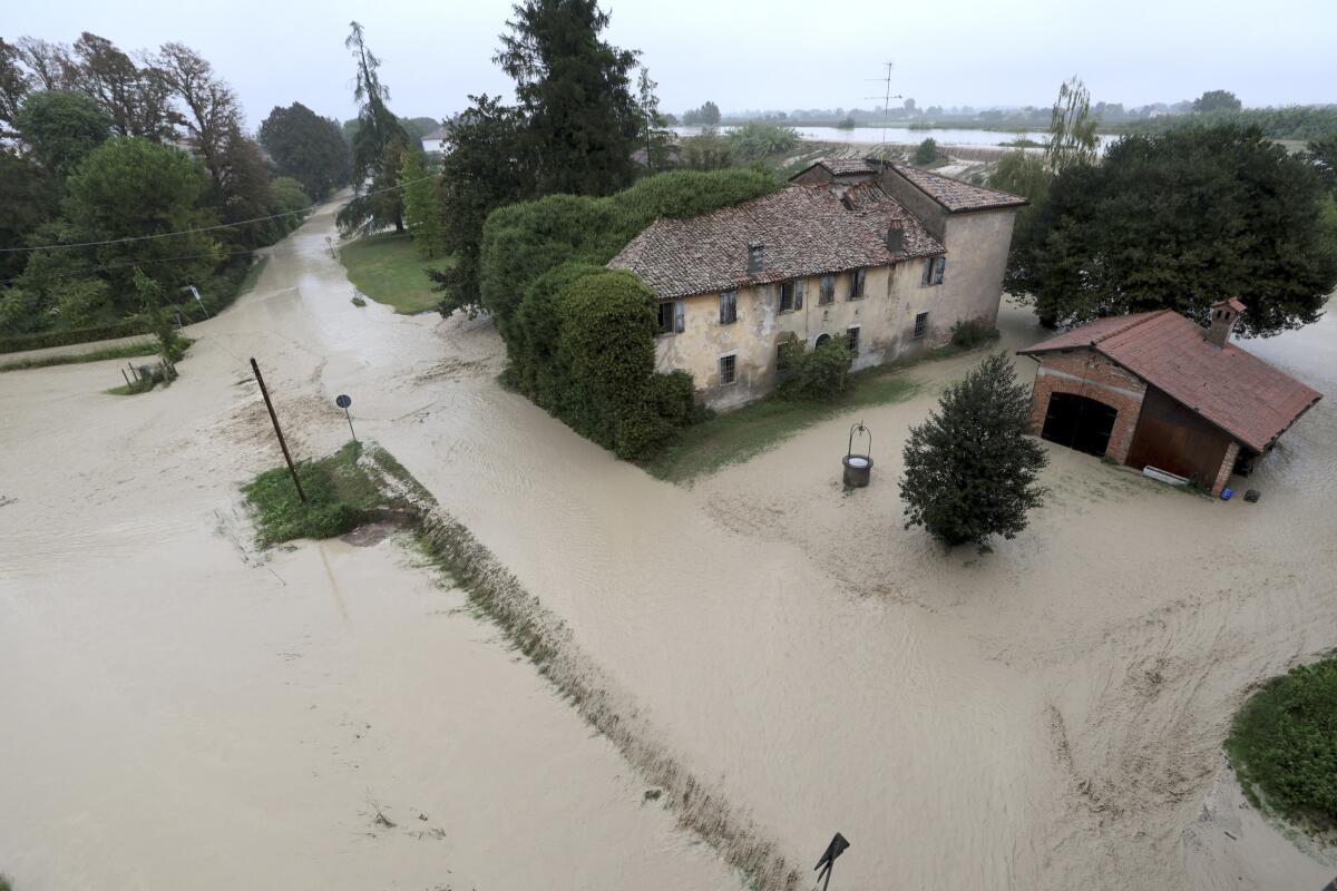 The Lamone River overflows its banks near Bagnacavallo in the Emilia-Romagna region of Italy on Thursday.