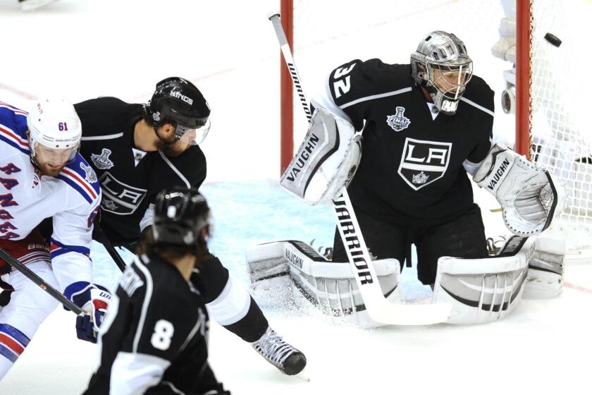 Kings goalie Jonathan Quick makes a save against the New York Rangers during the first period of Game 1 of the Stanley Cup Final.