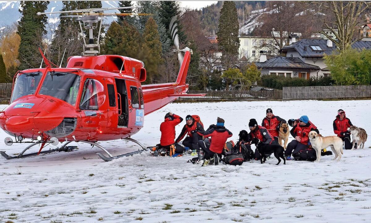 Rescuers prepare to search for skiers buried by an avalanche at the Wattener Lizum ski resort in Austria on Feb. 6, 2016.