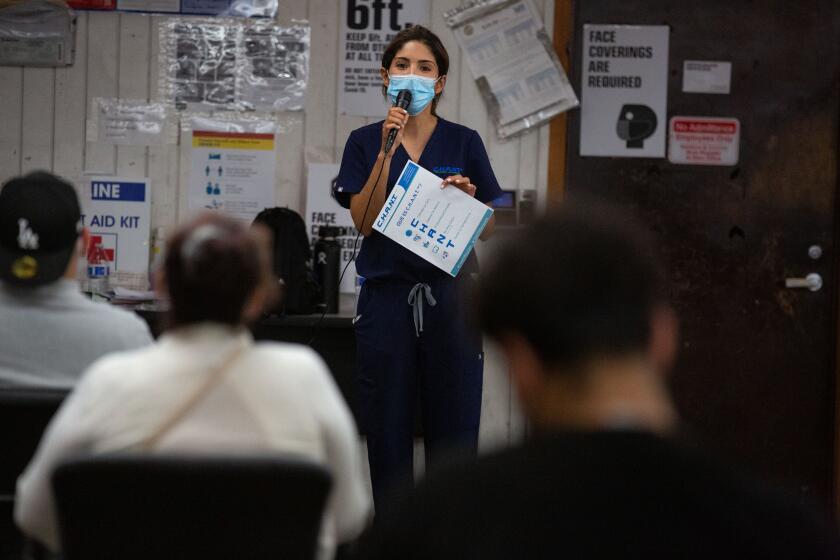 LOS ANGELES, CA - JULY 15: LA Apparel holds a health and safety training session for its employees after operations at the clothing factory were shutdown by city officials due to a huge coronavirus outbreak on Wednesday, July 15, 2020 in Los Angeles, CA. (Jason Armond / Los Angeles Times)