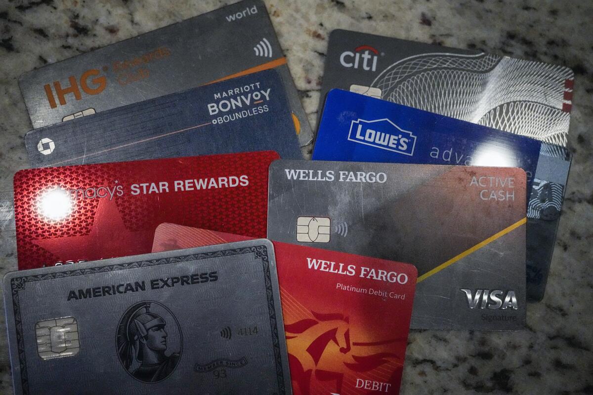 A variety of credit cards arranged on a granite surface