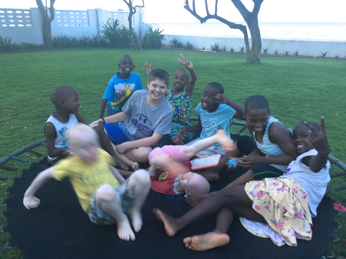 CJ Wheelan on a trampoline with new friends in Dar es Salaam, Tanzania.