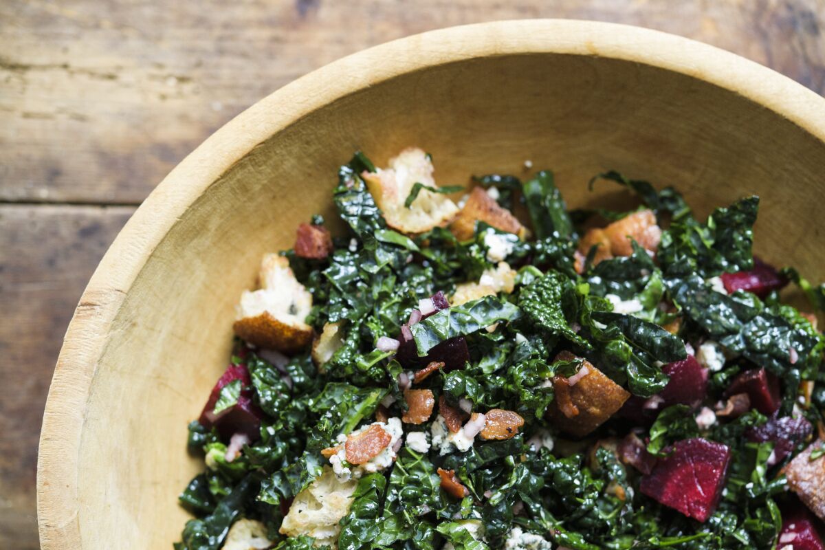 This image released by Milk Street shows a recipe for Bread Salad w/Kale, Beets & Blue Cheese. (Milk Street via AP)