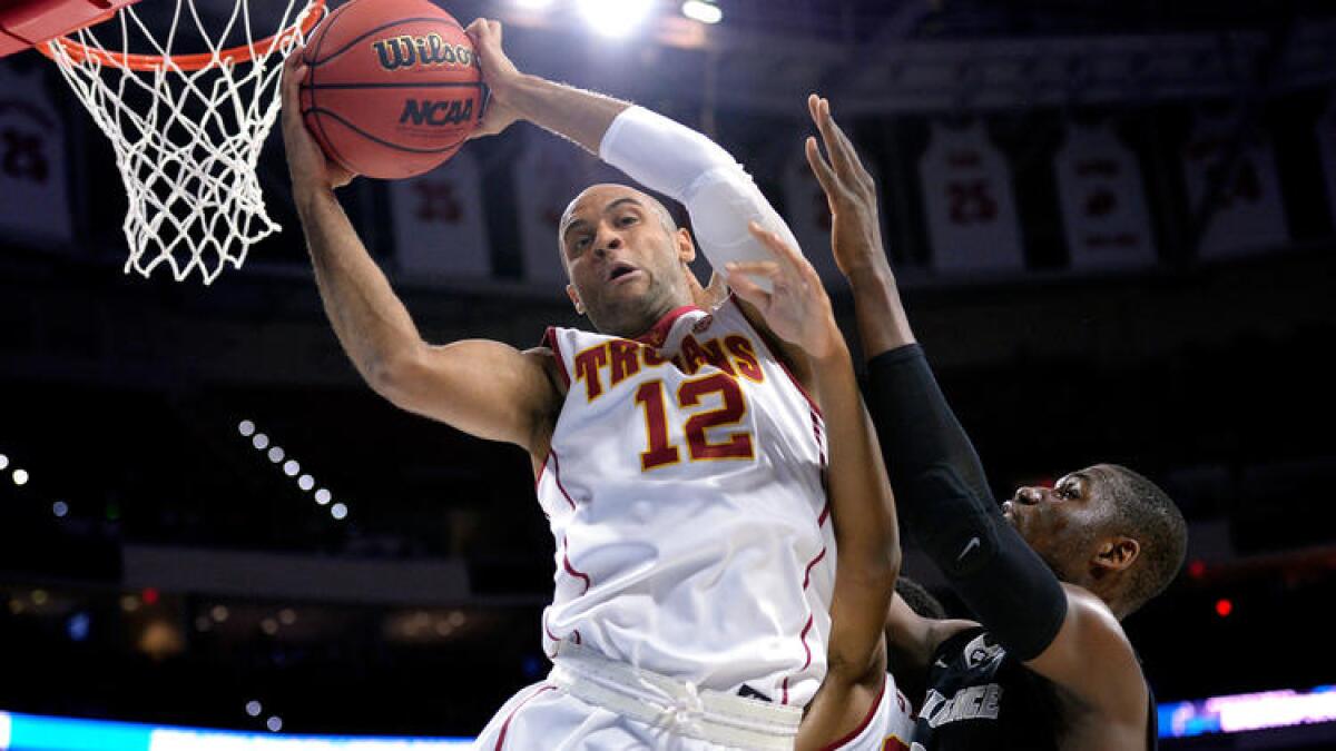 USC guard Julian Jacobs grabs a rebound against Providence forward Ben Bentil during the first half Thursday.