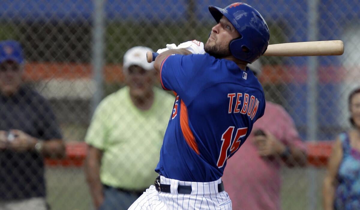 Tim Tebow hits a solo home run in his first at-bat during the first inning of his first instructional league baseball game for the New York Mets against the St. Louis Cardinals instructional club on Sept. 28.