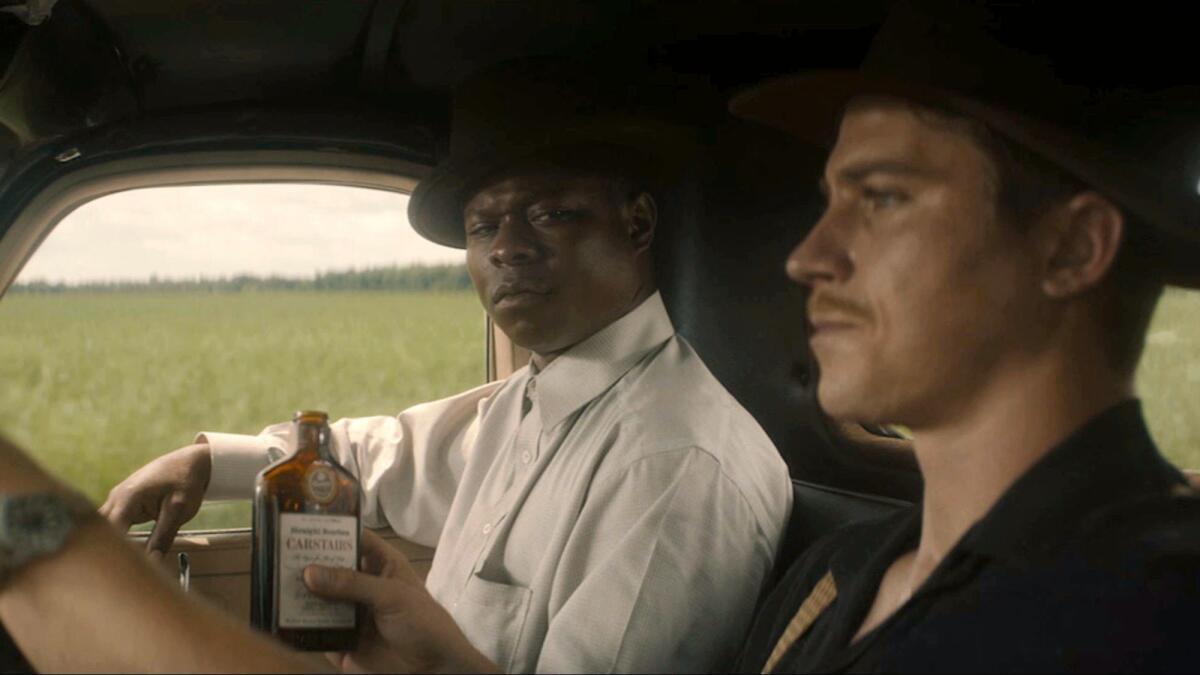 Jason Mitchell, left, and Garrett Hedlund in "Mudbound."