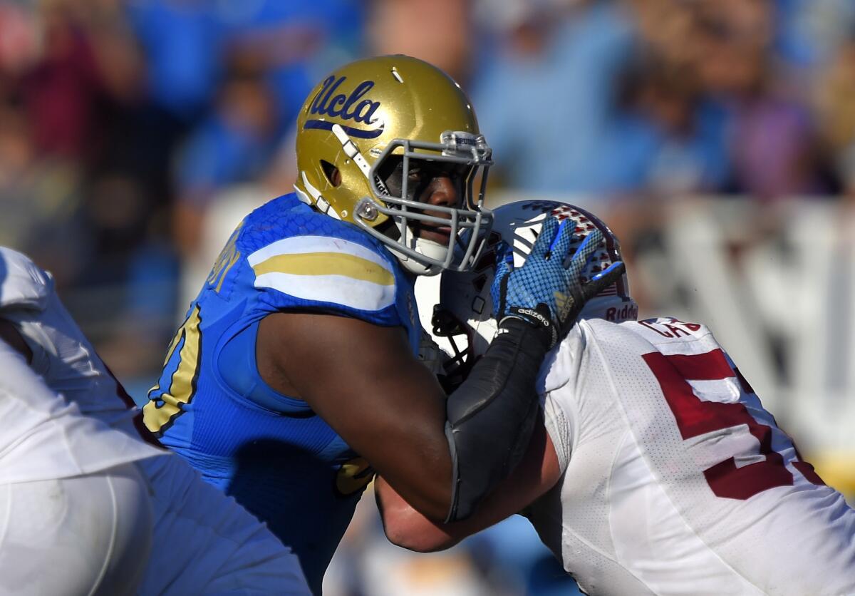 UCLA defensive lineman Ellis McCarthy tries to get by Stanford guard Johnny Caspers during the second half of a game on Nov. 28.