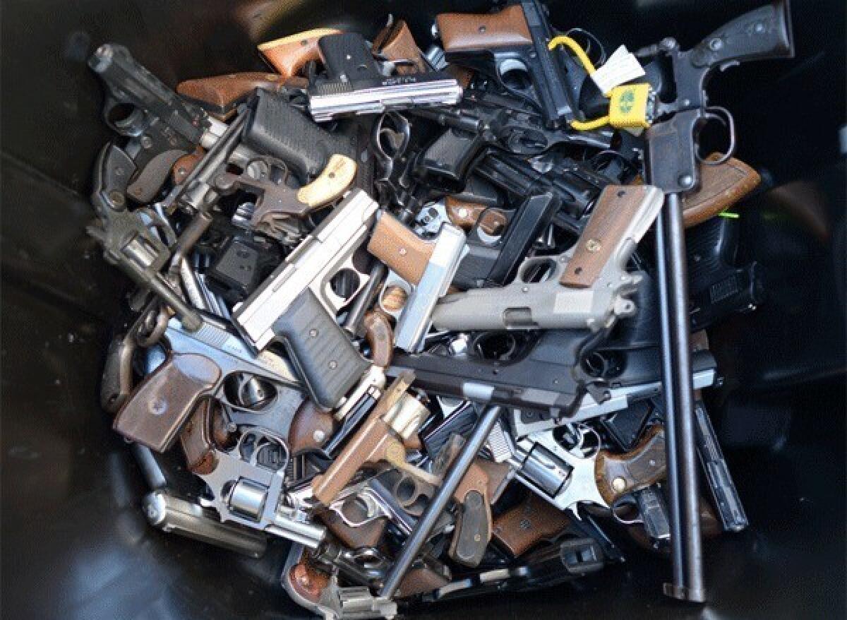 According to James Alan Fox, Northeastern University criminologist, between 1980 and 2010 there were, on average, 20 mass murders a year (defined by the FBI as four or more killings in the same incident) with an average annual death toll of about 100. Above: A trash bin full of handguns collected during the LAPD Gun Buyback Program event on Dec. 26.