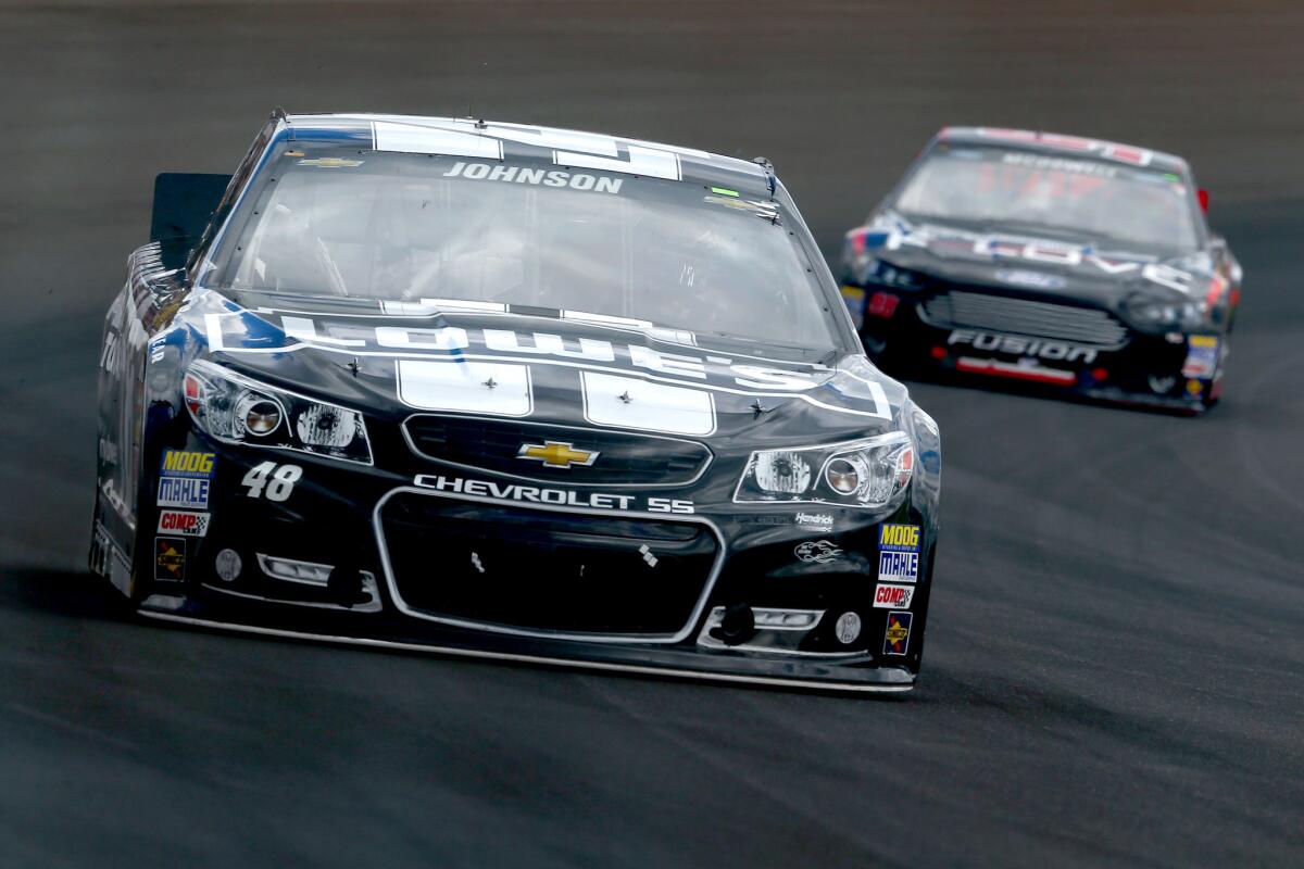 Jimmie Johnson leads the Brickyard 400 during the first half of the race Sunday at Indianapolis Motor Speedway.