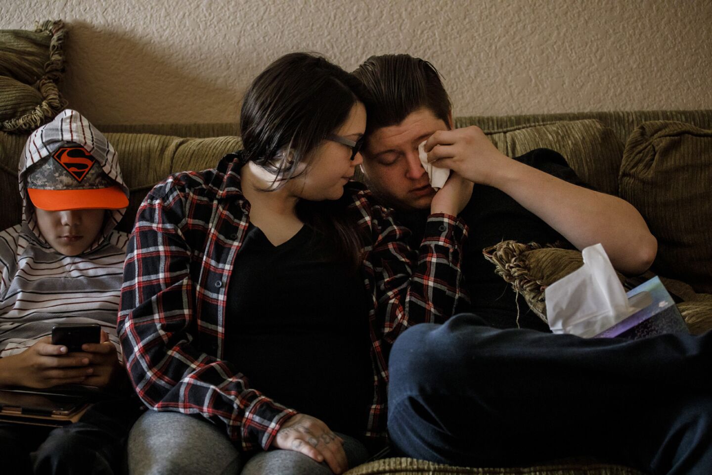 Alexandria Wilson, 21, consoles her boyfriend, Jacob Golden, 25, as they recount their harrowing escape from the Camp Fire at a relative's house in Applegate, Calif.