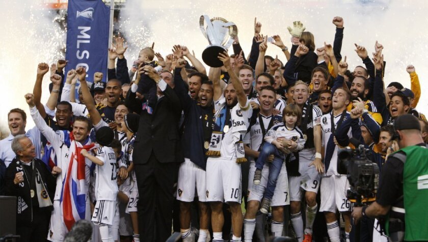 Members of the Galaxy celebrate their MLS championship.