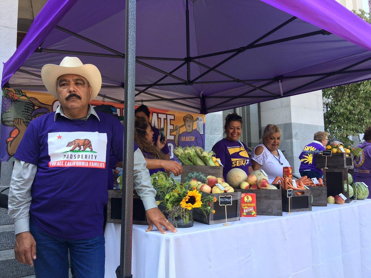 Members of SEIU rally in support of a bill to protect workers without legal residency in the country.