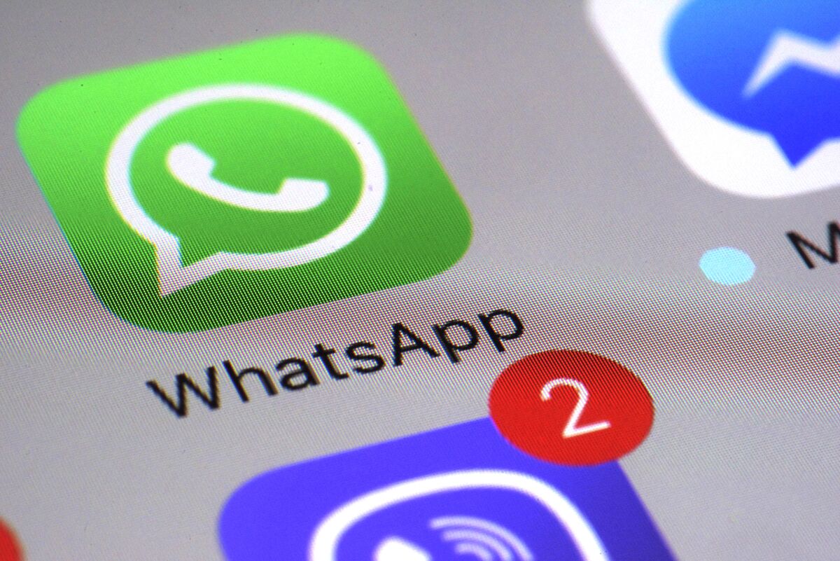 The WhatsApp icon on smartphone screen