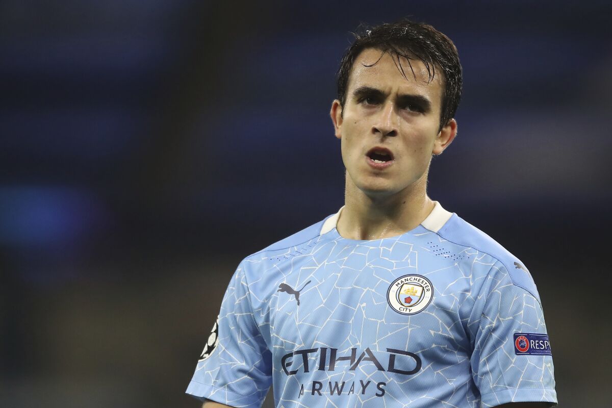 FILE - In this Oct. 21, 2020 file photo, Manchester City's Eric Garcia is seen during the Champions League group C soccer match between Manchester City and FC Porto at the Etihad stadium in Manchester, England. Barcelona says it reached a deal to sign defender Eric Garcia from Manchester City. It brings the 20-year-old defender home four years after he left the club to join the English champion. Barcelona says Garcia’s five-year contract will begin July 1 after his City deal expires. (Martin Rickett/Pool via AP)