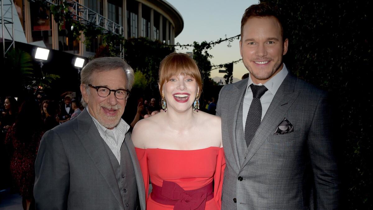 "Jurassic World: Fallen Kingdom" executive producer Steven Spielberg, left, and two of the film's stars, Bryce Dallas Howard and Chris Pratt.