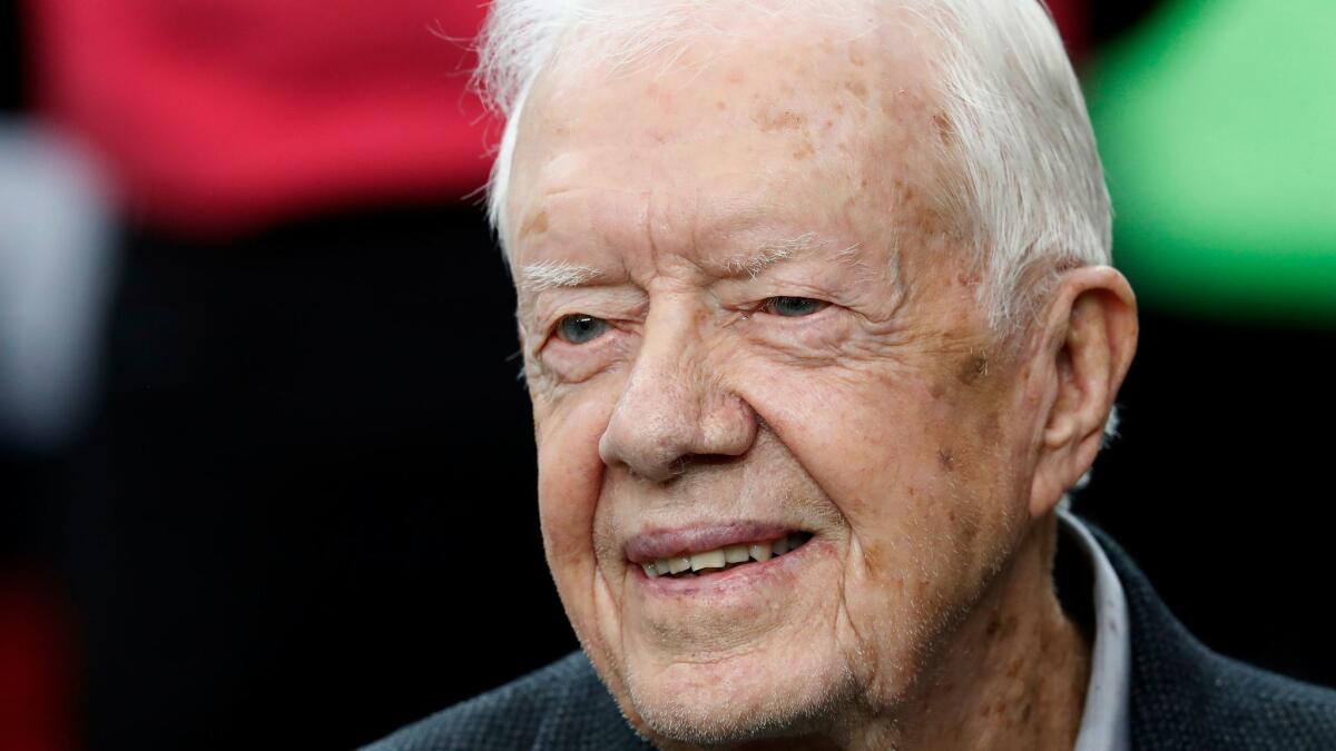 Former President Carter attends a game between the Atlanta Falcons and the San Diego Chargers in Atlanta on Oct. 23, 2016.