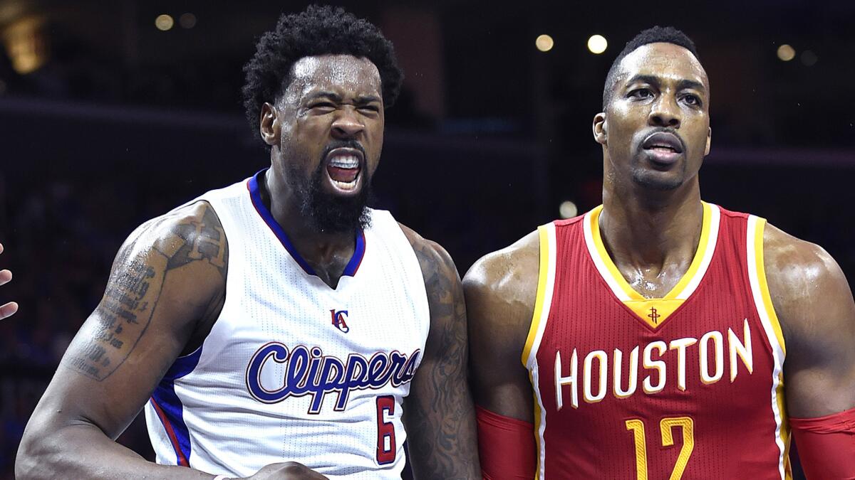 Clippers center DeAndre Jordan, left, celebrates next to Houston Rockets forward Dwight Howard during the Clippers' win in Game 3 of the Western Conference semifinals on Friday.