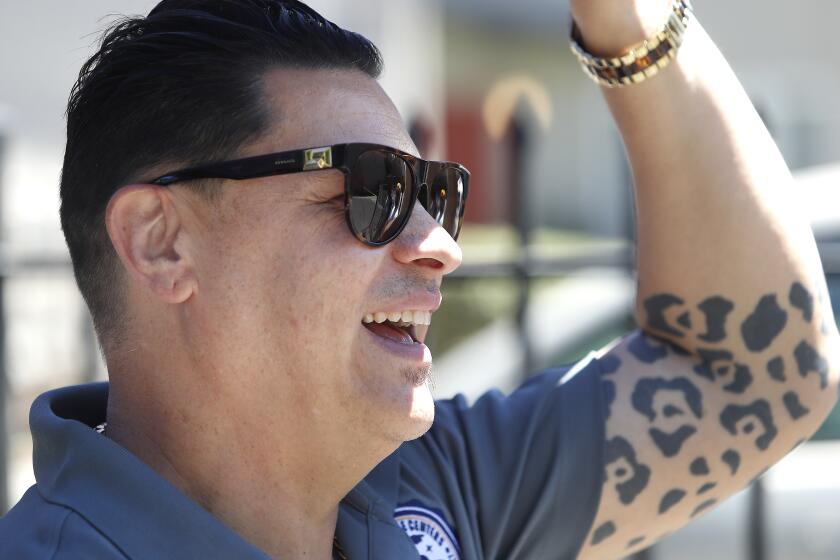 Motecuzoma (Motec) Sanchez is the founder of 209 Times and is shown watching rappers perform during his "Summer of Love" food and gift giveaway sponsored by the Sanchez's, Family Resource Center, which are also part of the Stockton Unified School District, Wednesday, July 6, 2022 in Stockton, Calif. (Gary Kazanjian / For The Times)