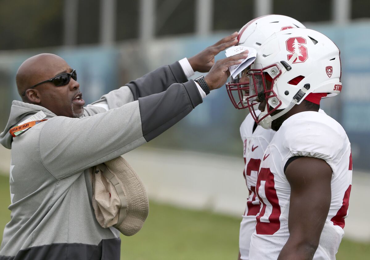 Ron Gould, left, was running backs coach at Stanford the past six seasons before joining the staff at San Diego State.