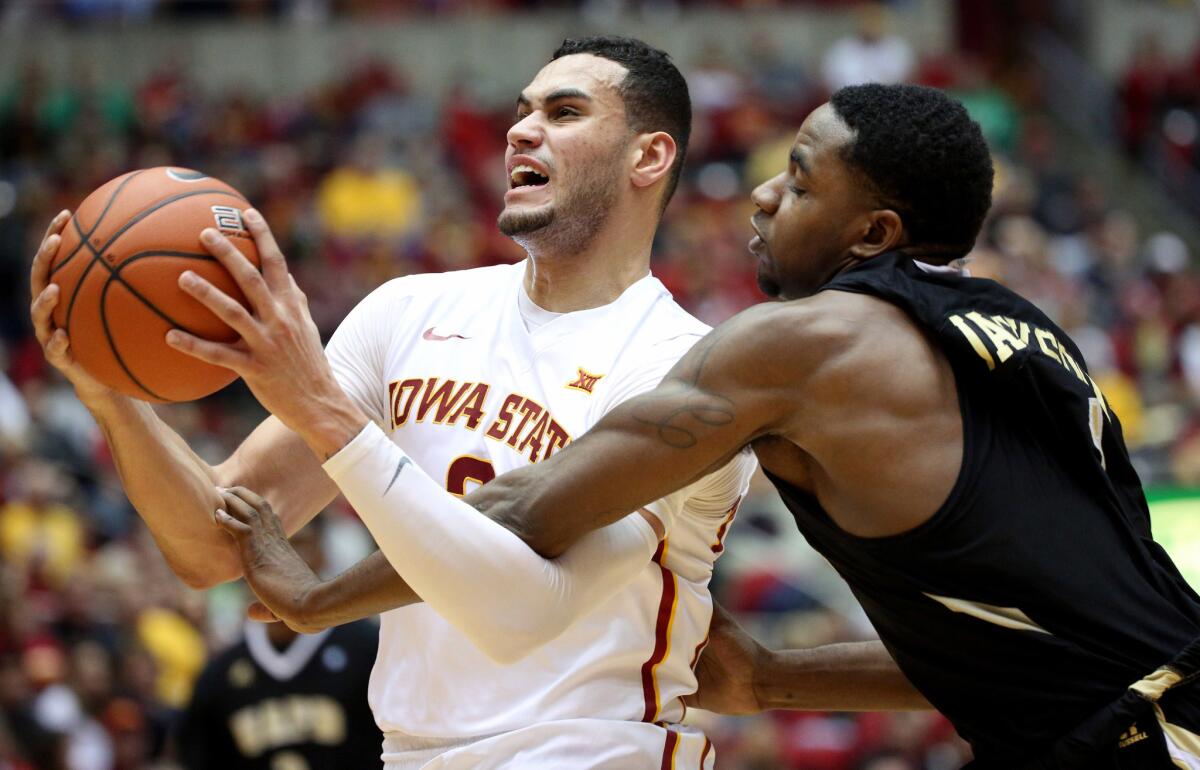Iowa State forward Abdel Nader (2) is fouled by Arkansas-Pine Bluff guard Charles Jackson (1) as he goes up for a shot during the first half.