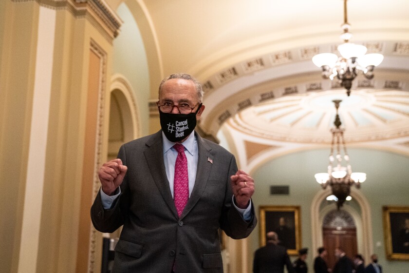 Majority Leader Charles Schumer reacts outside the Senate chamber