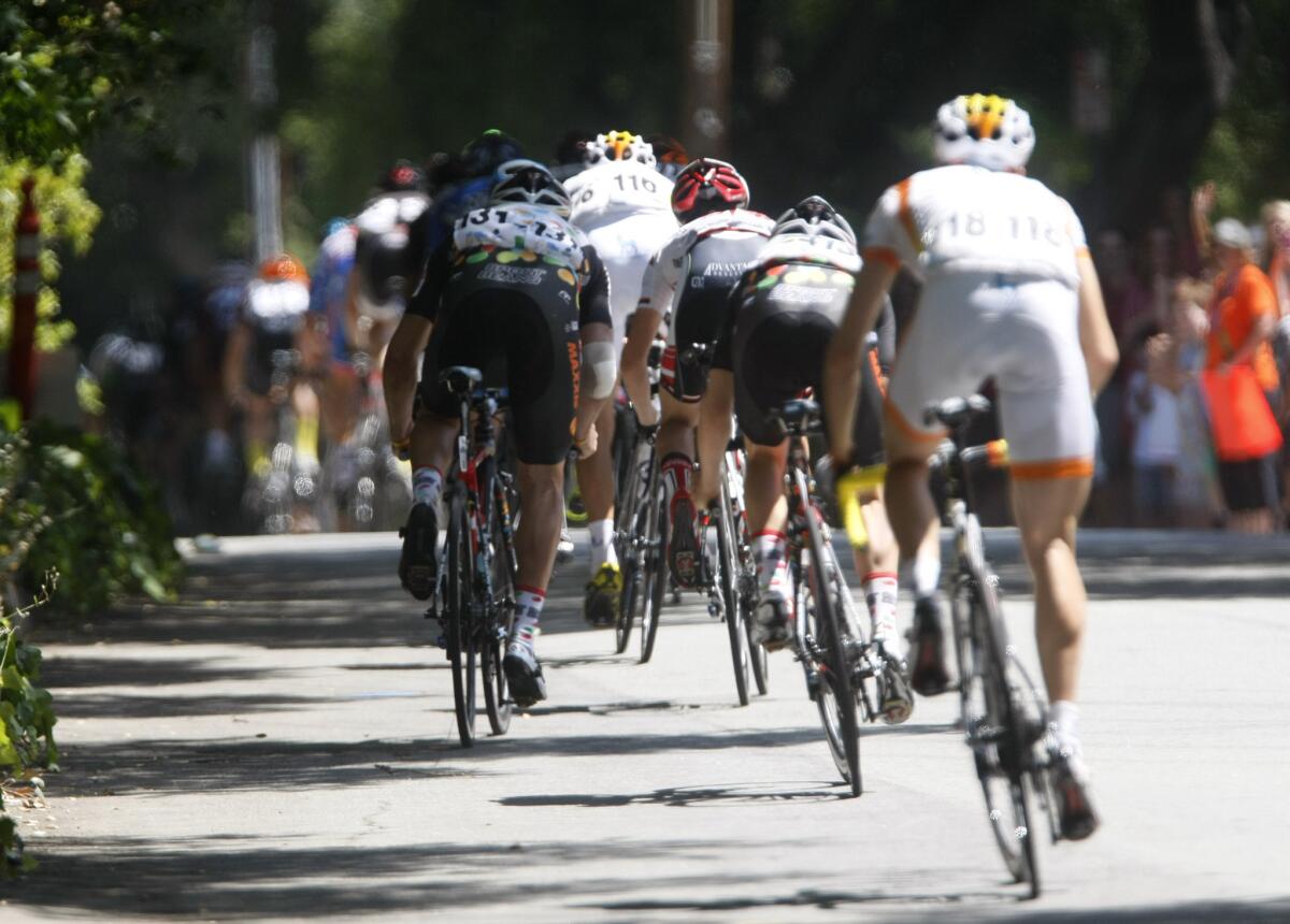 Participants of the Amgen Tour of California head southbound on Commonwealth Avenue in La Cañada.