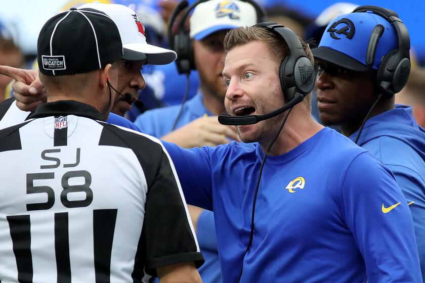INGLEWOOD, CALIF. - OCT. 16, 2022. Rams head coach Sean McVay talks with an official in the third quarter.