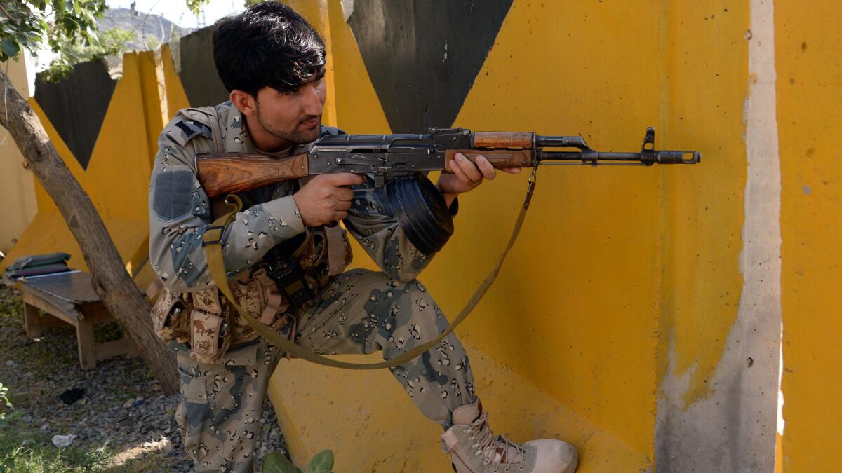 An Afghan border policeman on patrol after overnight clashes with Pakistani forces on the border between Afghanistan and Pakistan in eastern Nangarhar province on Monday.