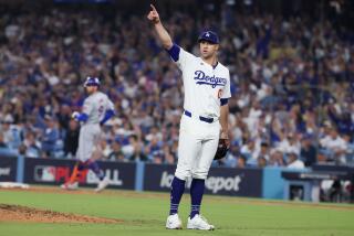 LOS ANGELES, CALIFORNIA - OCTOBER 13: Jack Flaherty #0 of the Los Angeles Dodgers points.