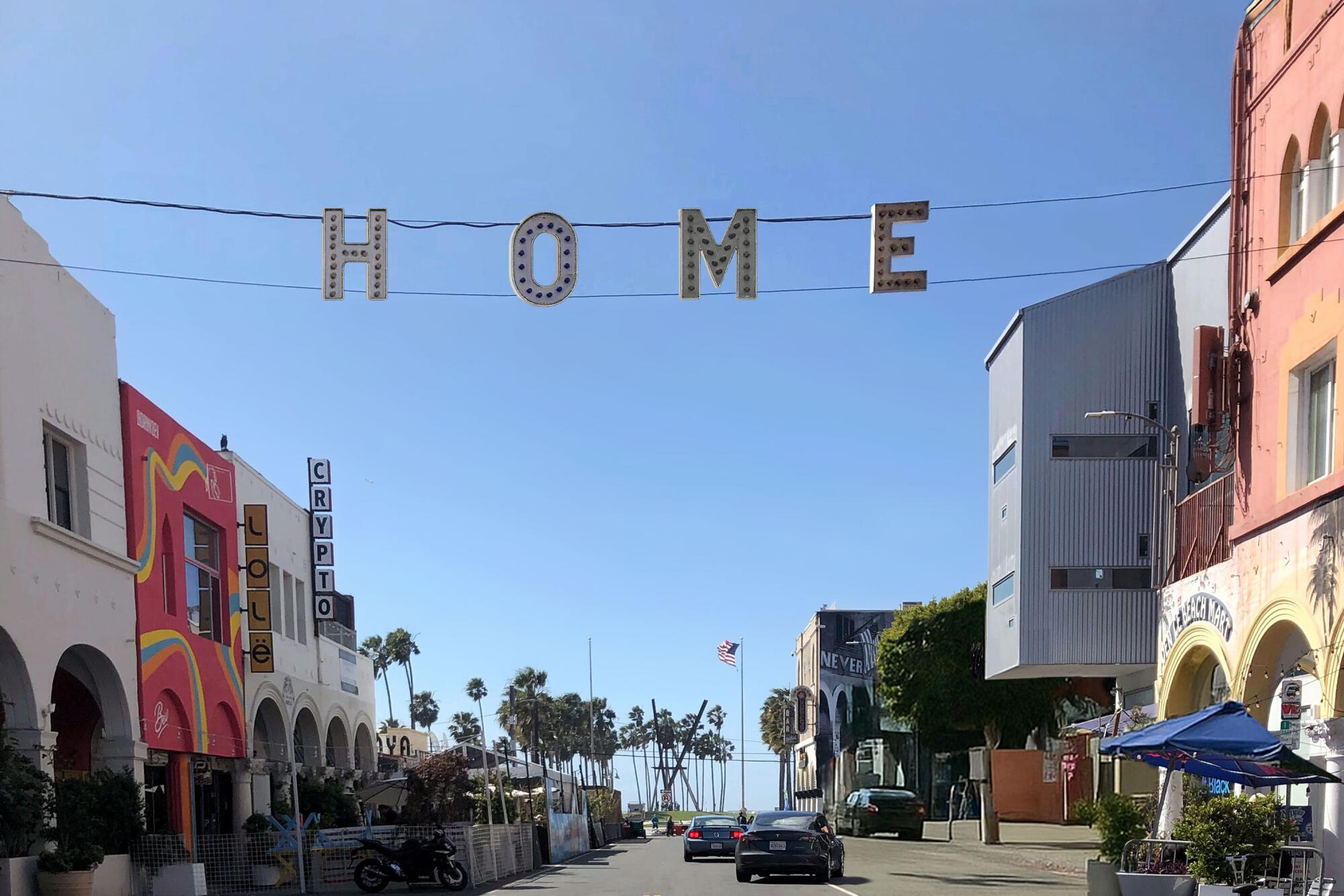 Iconic VENICE sign in Venice, California, altered to read “HOME.”
