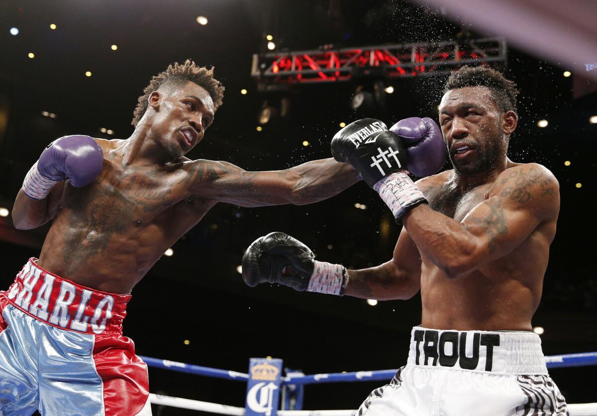 Jermall Charlo lands a left against Austin Trout during their IBF super-welterweight title fight in Las Vegas on Saturday.