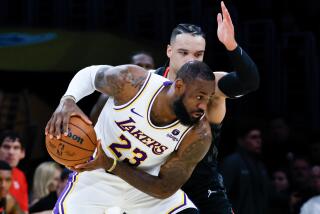 LOS ANGELES, CA - NOVEMBER 19: Los Angeles Lakers forward LeBron James (23) handles the ball.