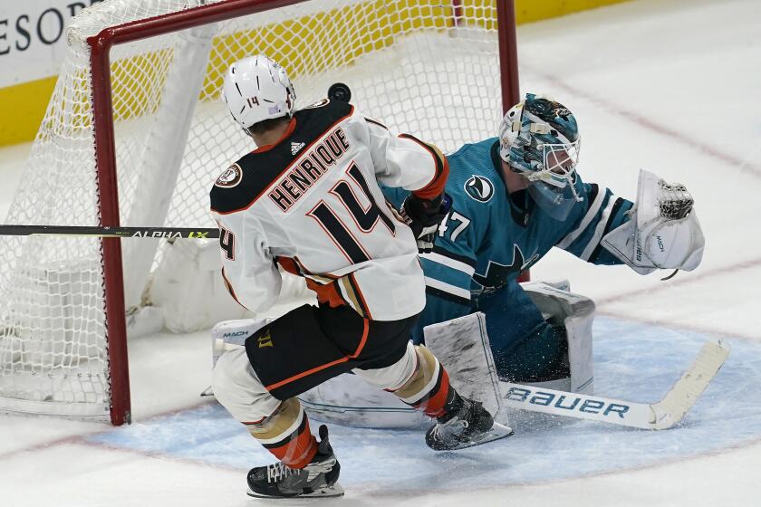Anaheim Ducks center Adam Henrique (14) scores a goal past San Jose Sharks goaltender James Reimer.