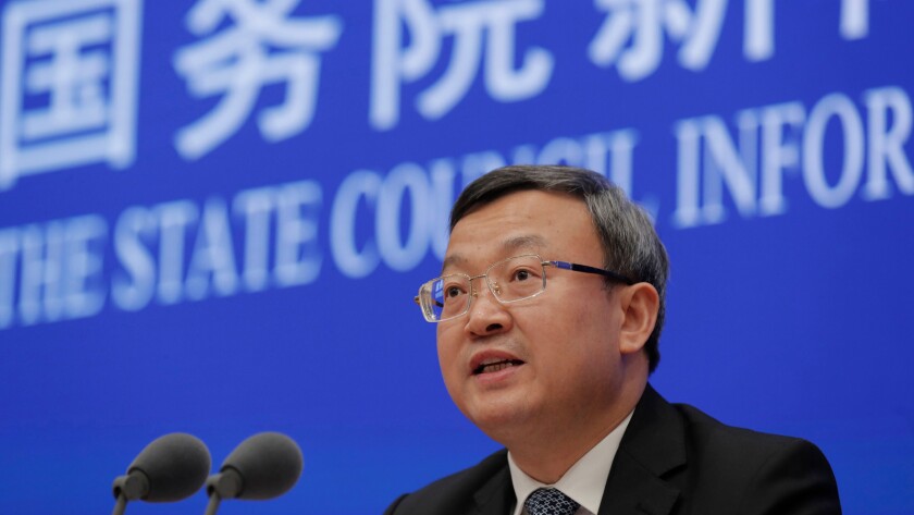 Vice Minister of Commerce Wang Shouwen speaks Sunday at a press conference in Beijing.