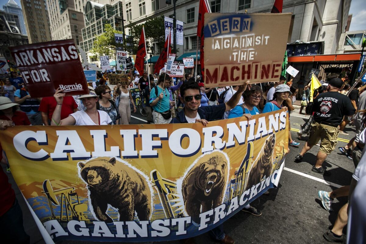 Demonstrators take part in a clean-energy march in Philadelphia on Sunday. (Marcus Yam / Los Angeles Times)