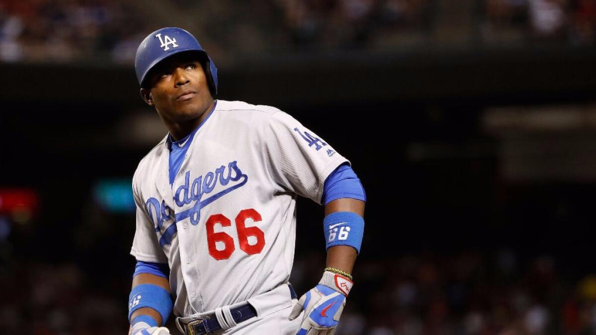 Dodgers outfielder Yasiel Puig reacts as he bats during the eighth inning of a game against the Diamondbacks on July 16.