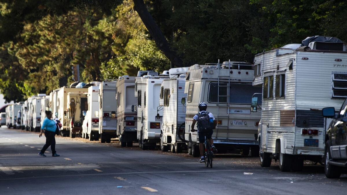 Affordable housing is so scarce in Mountain View, Calif., that many residents are living in RVs like these along Cristano Avenue.