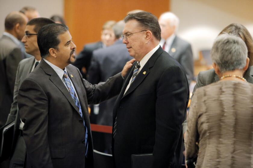 San Bruno Councilman Rico Medina speaks with Mayor Jim Ruane during a break in the NTSB hearings on the 2010 PG&E pipeline blast in Washington DC, on Tuesday, August 30, 2011. (Photo By Carlos Avila Gonzalez/The San Francisco Chronicle via Getty Images)