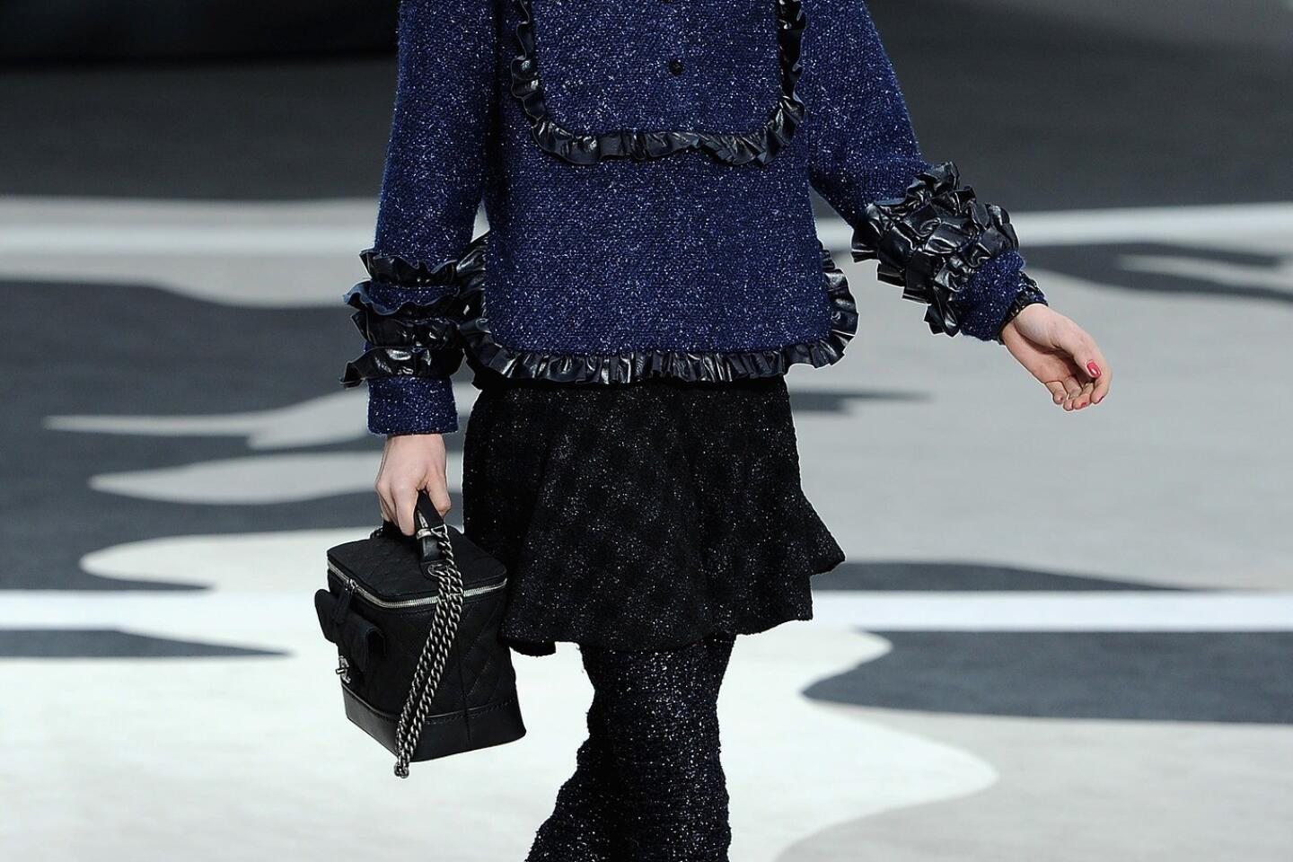 A model, bag detail, walks the runway during the Chanel show as part  News Photo - Getty Images