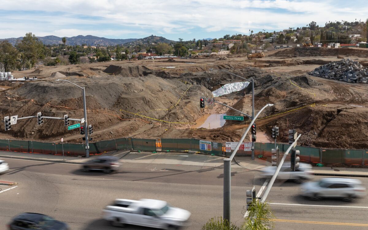 Valley Parkway traffic moves past the site of the new Palomar Heights project.