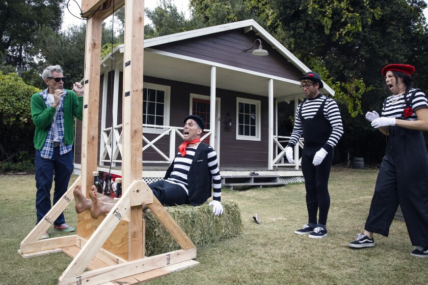 A man and three people in mime outfits in the movie "Jackass Forever"