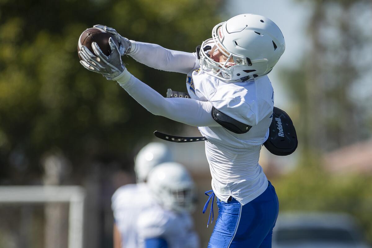 Fountain Valley's Blake Anderson goes up for a ball during practice on Aug. 8.
