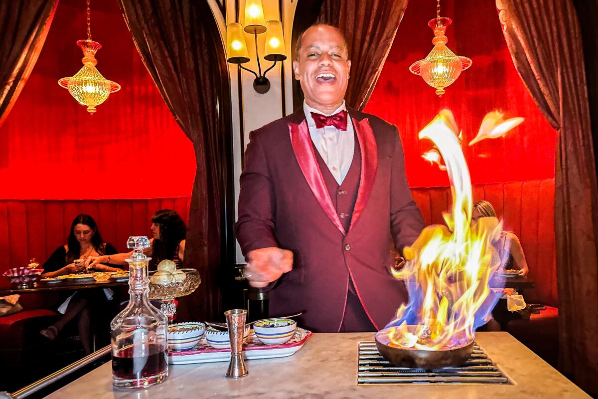 A chef flames a dish of bananas foster