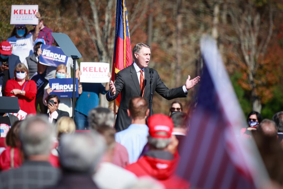Sen. David Perdue speaks at the rally in Canton, Ga.