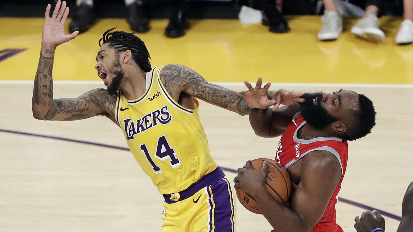Rockets guard James Harden collides with Lakers forward Brandon Ingram, who was called for a foul on the play with 4 minutes left in the fourth quarter. That led to an exchange of words before Ingram shoved Harden, igniting a brawl.