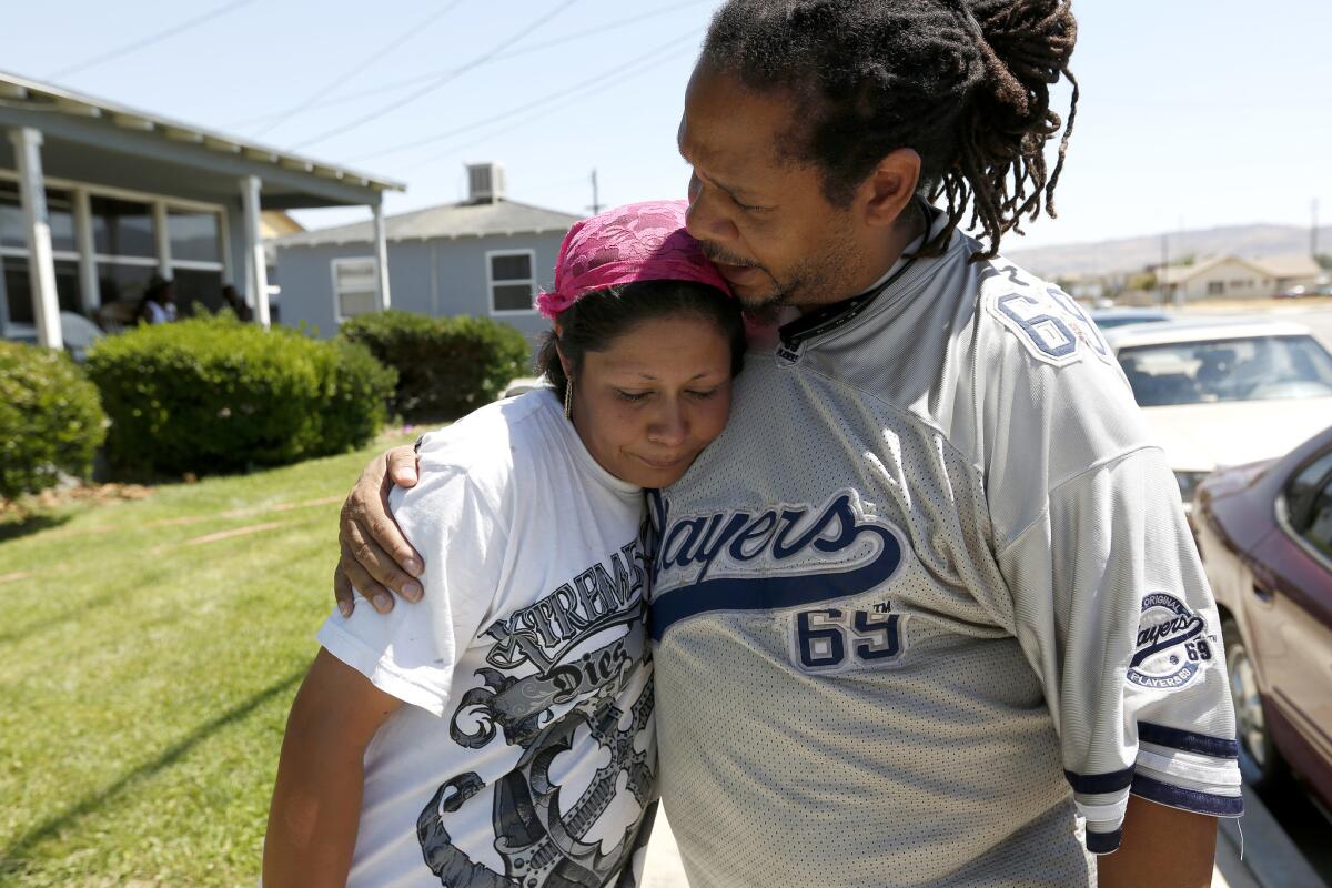 Roberta Alcantar, mother of the victim, is comforted by Pharaoh Mitchell