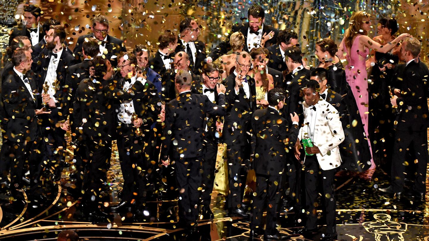 The production team and cast of Spotlight celebrate the award for best picture.