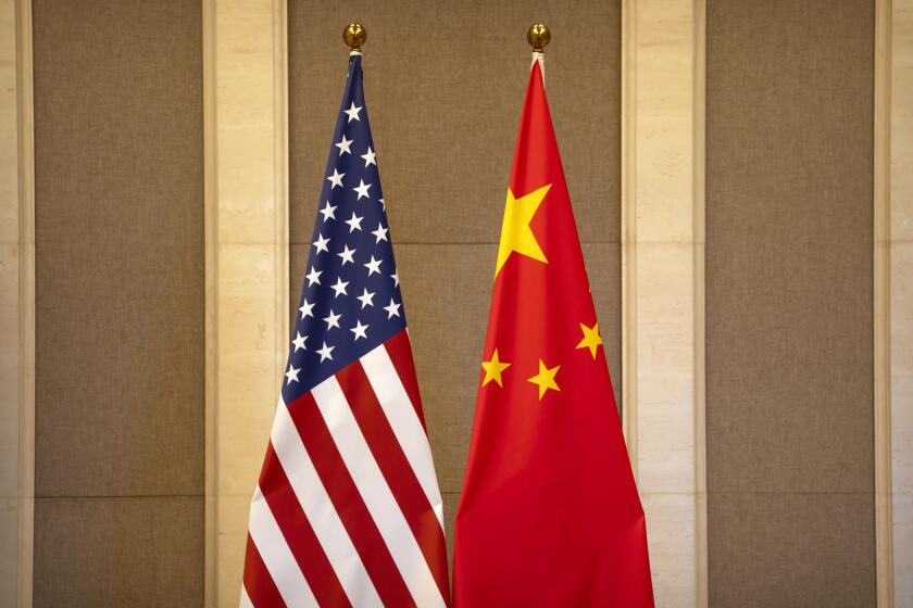 FILE - United States and Chinese flags are set up before a meeting between Treasury Secretary Janet Yellen and Chinese Vice Premier He Lifeng at the Diaoyutai State Guesthouse in Beijing, on July 8, 2023. China said the United States is the "biggest disruptor of regional peace and stability" in the world in a scathing response Wednesday, Oct. 25, 2023 to a Pentagon report on China's growing military buildup. (AP Photo/Mark Schiefelbein, Pool, File)