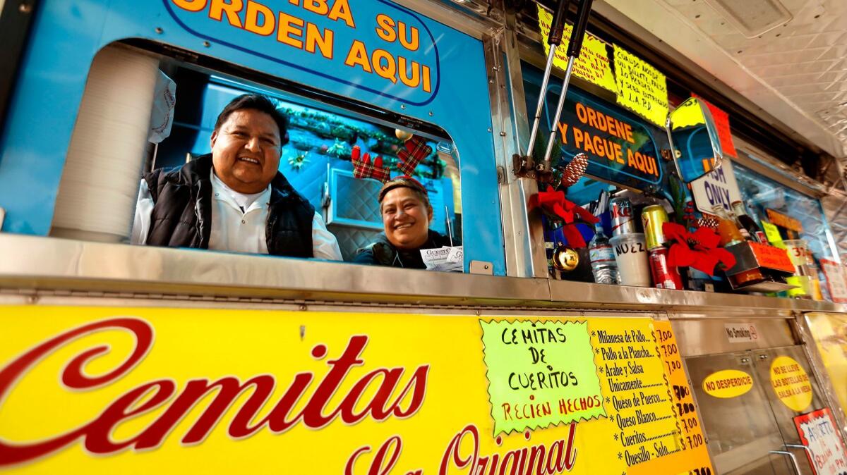 Juan Andrade and Leonore Rodriguez at the Cemitas Tepeaca Puebla truck, parked along Whittier Boulevard.